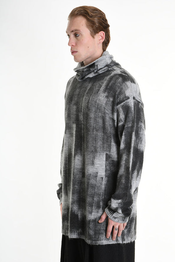 Patterned gray sweater.