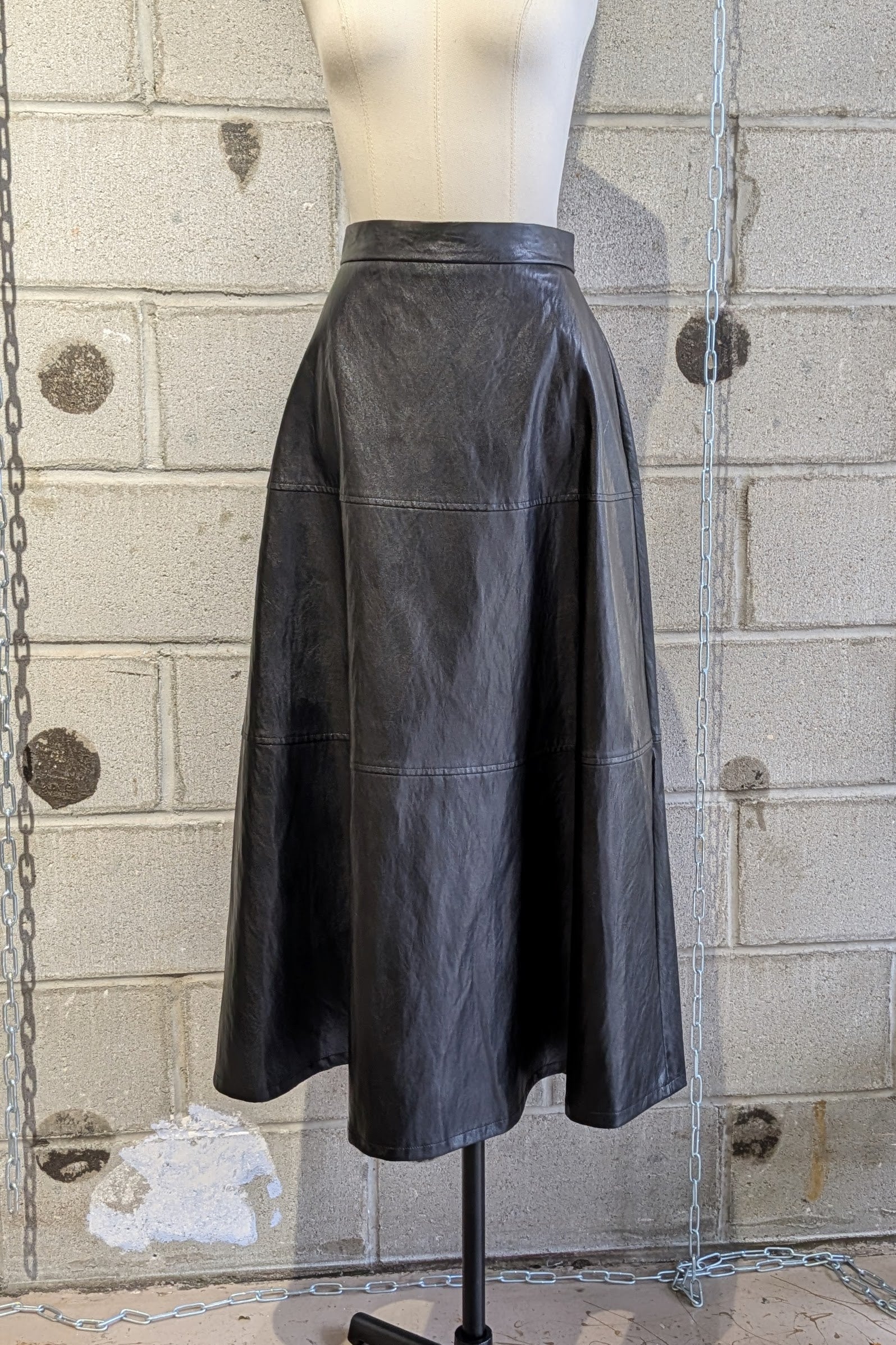 Mignon Doo Faux Leather black Midi Skirt with a back zipper. NYC - LiLi The First boutique