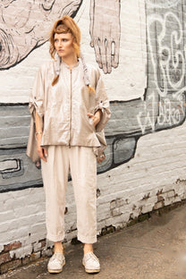 a pale tint of off-white with a shine cardigan