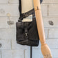 Sandrine Philippe leather harness top with a bag