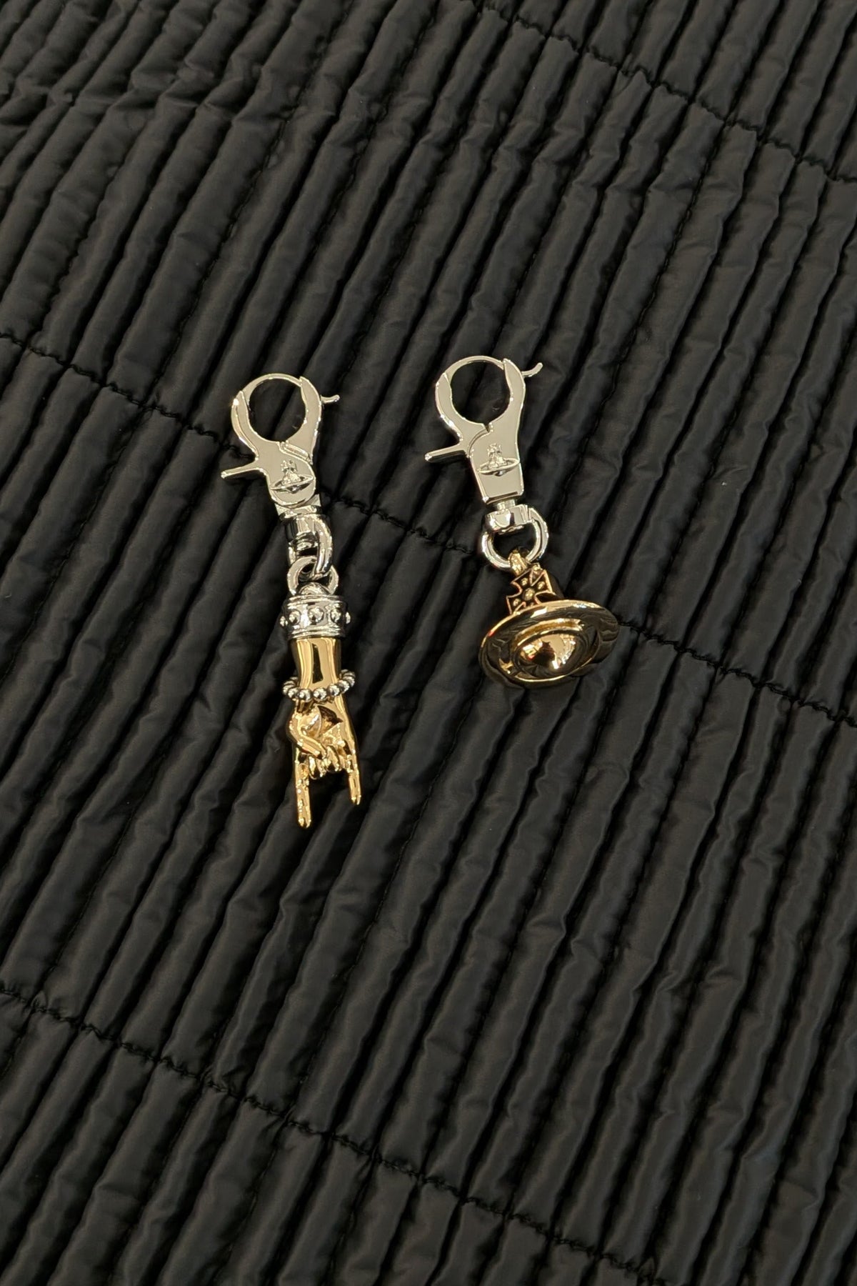 Vivienne Westwood. Anatoly earrings, uneven pair, handcuffs